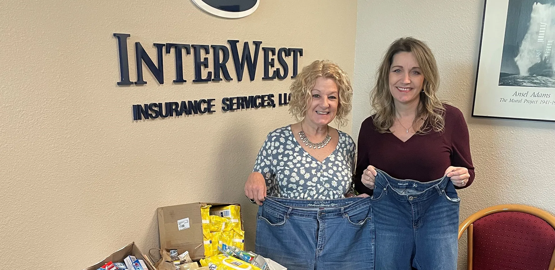 Two team members from the InterWest Merced Office with donations for those affected by flooding.