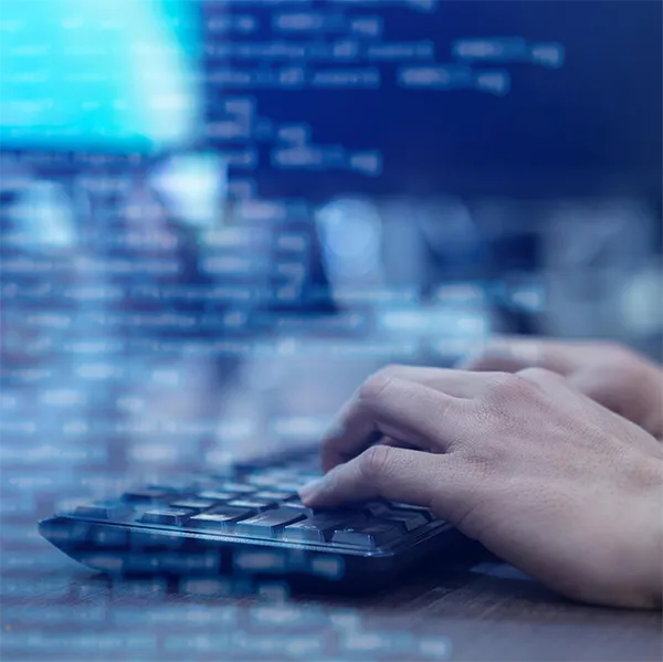 Someone typing on a keyboard.