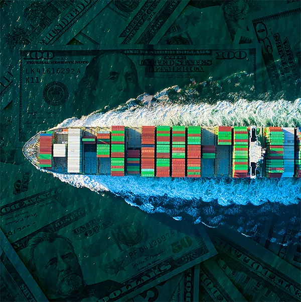 An overhead view of a boat full of shipping containers, with $50 and $100 bills replacing the ocean water.