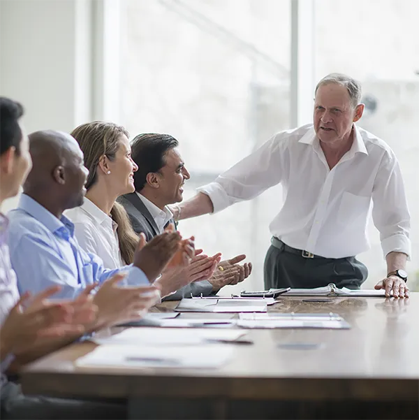 A leader giving a presentation to his team in a professional environment.