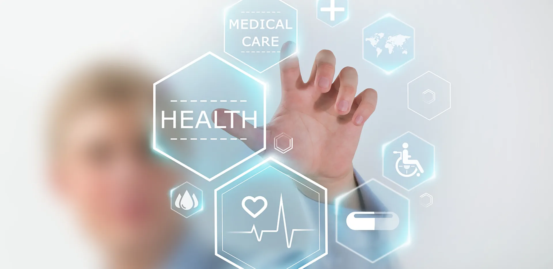 A hand selects from different health care related icons.